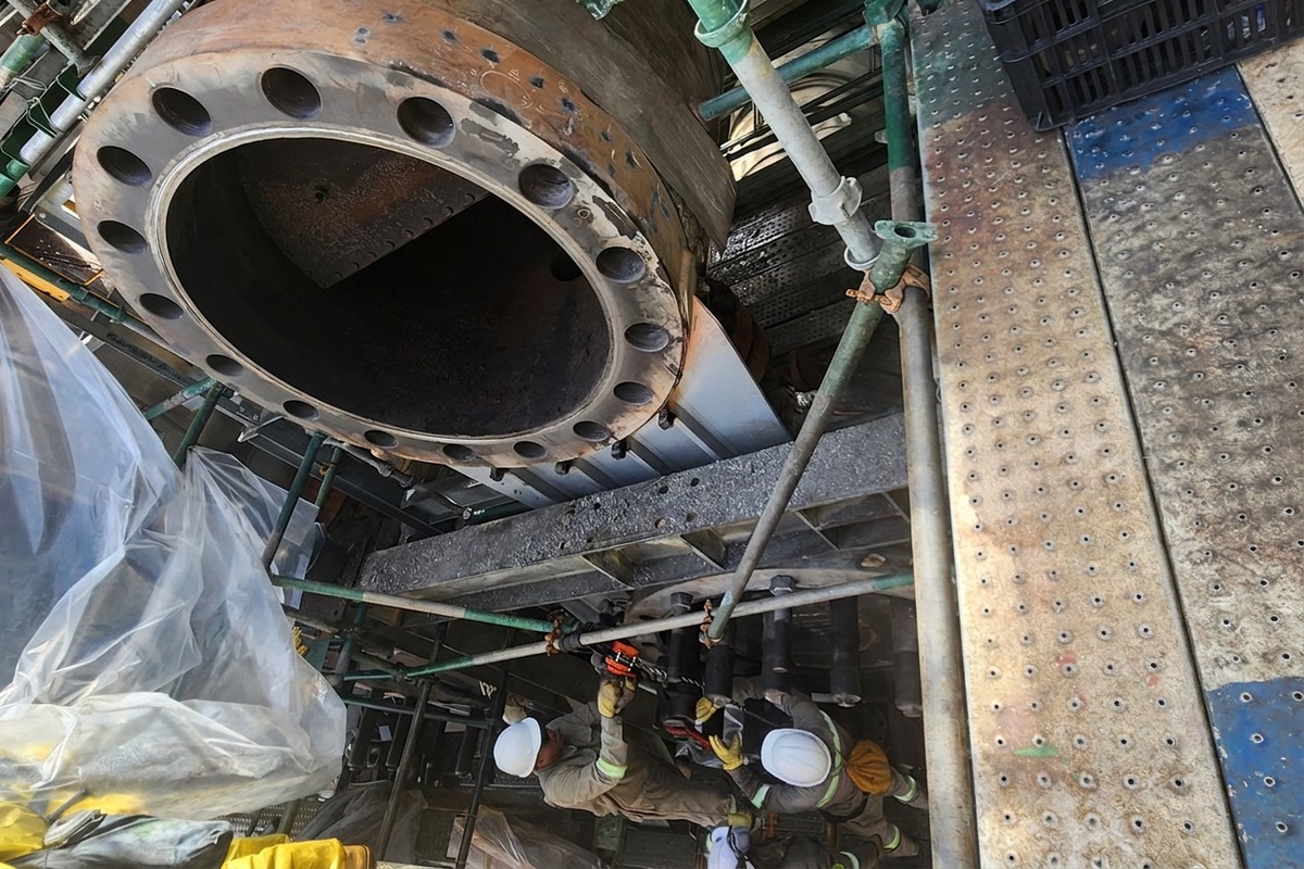 Heat-exchanger cover set back in place over the studs after the taper conversion