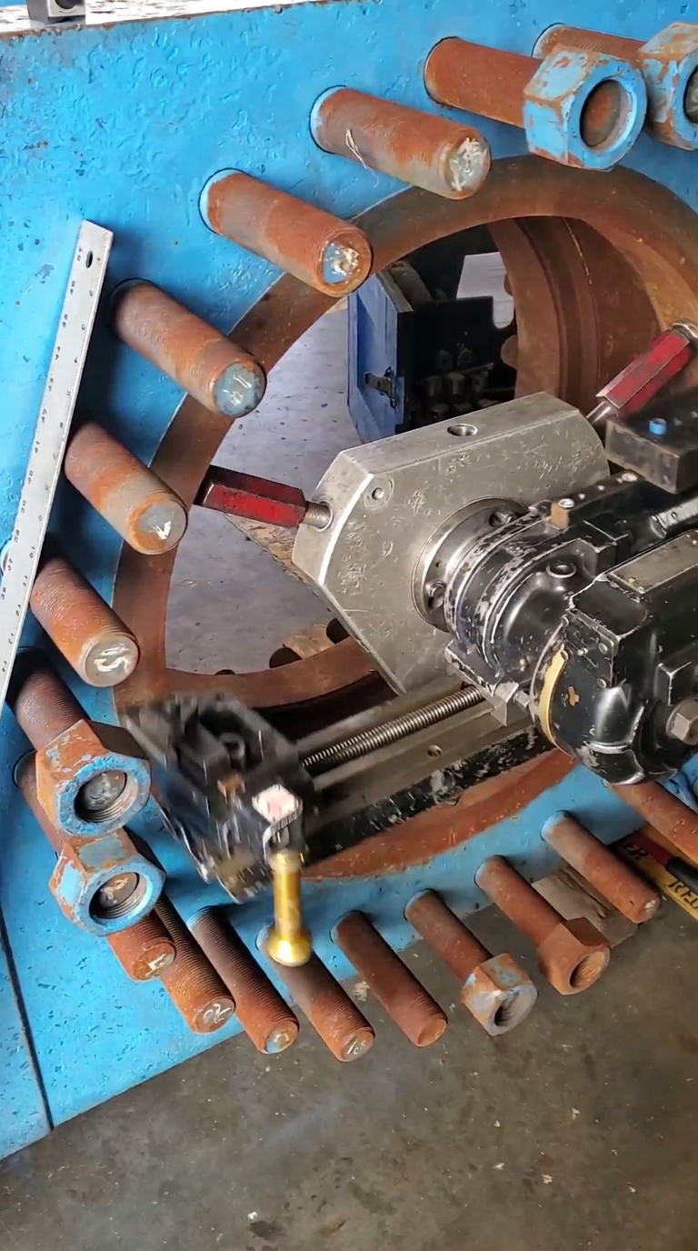 Boring bar setup indicated through the sandwich-valve bolt circle with the studs left in place